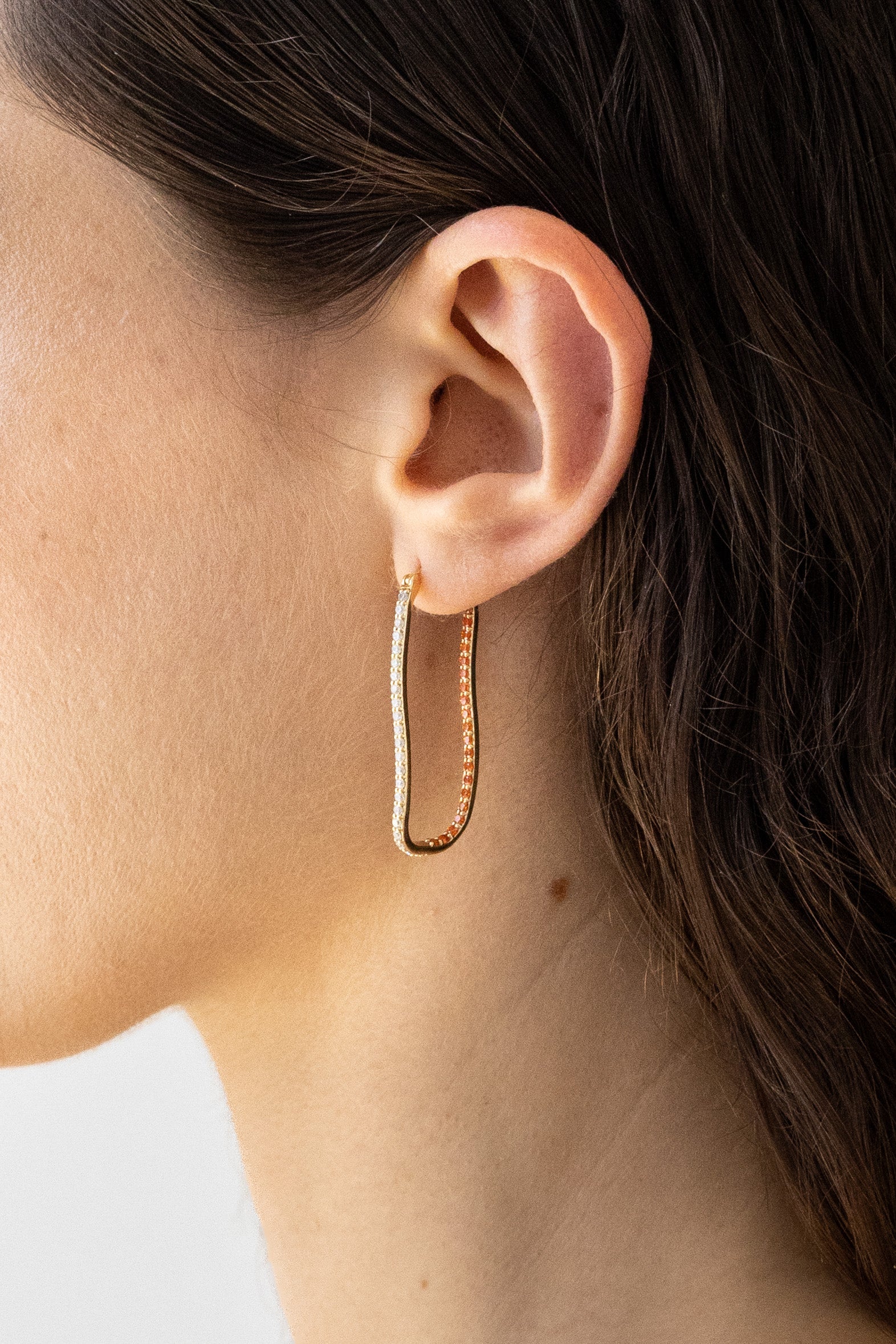 Flash Jewellery Fiasco Paved Hoop Earrings with Tangerine Gemstones in 14k Gold Vermeil on Model close up