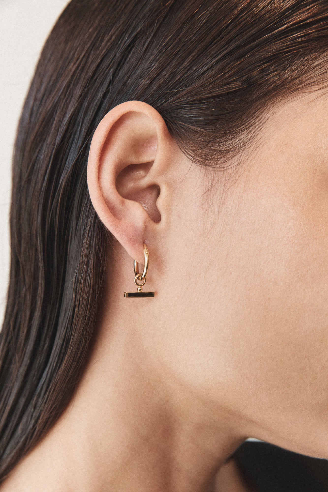 Flash Jewellery Chloe Sleeper Hoop Earrings in 14k Gold Vermeil On model close-up